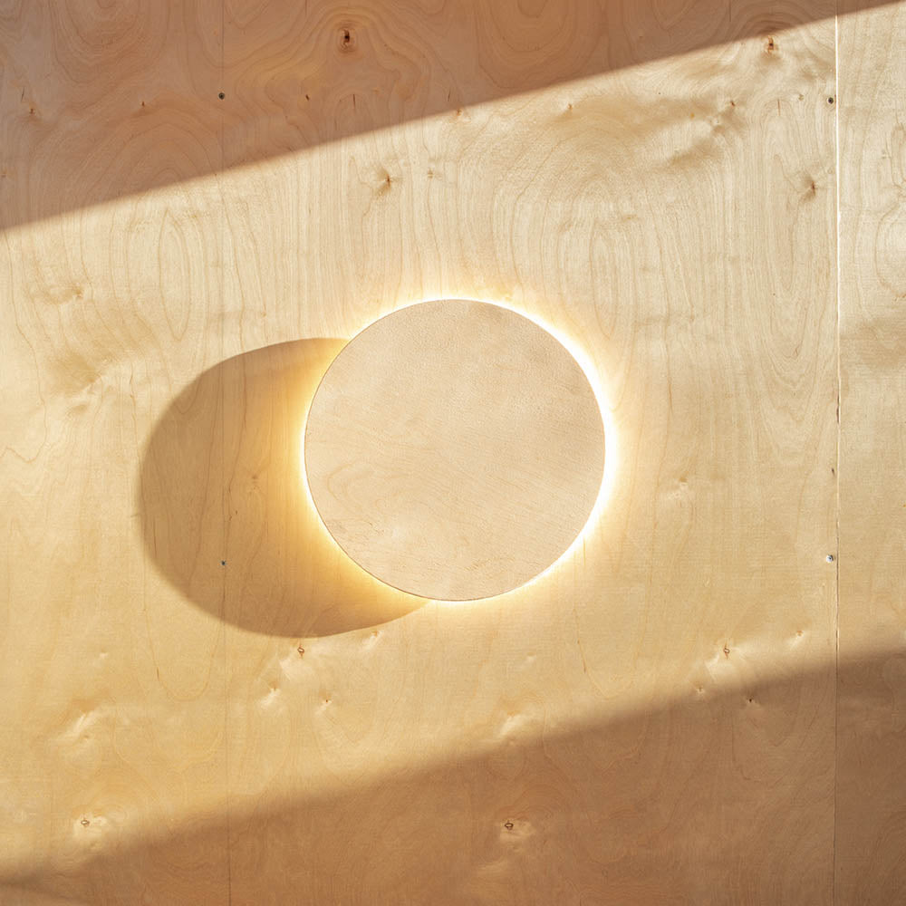 Minarc Plus Hus, backlit circular wood installation